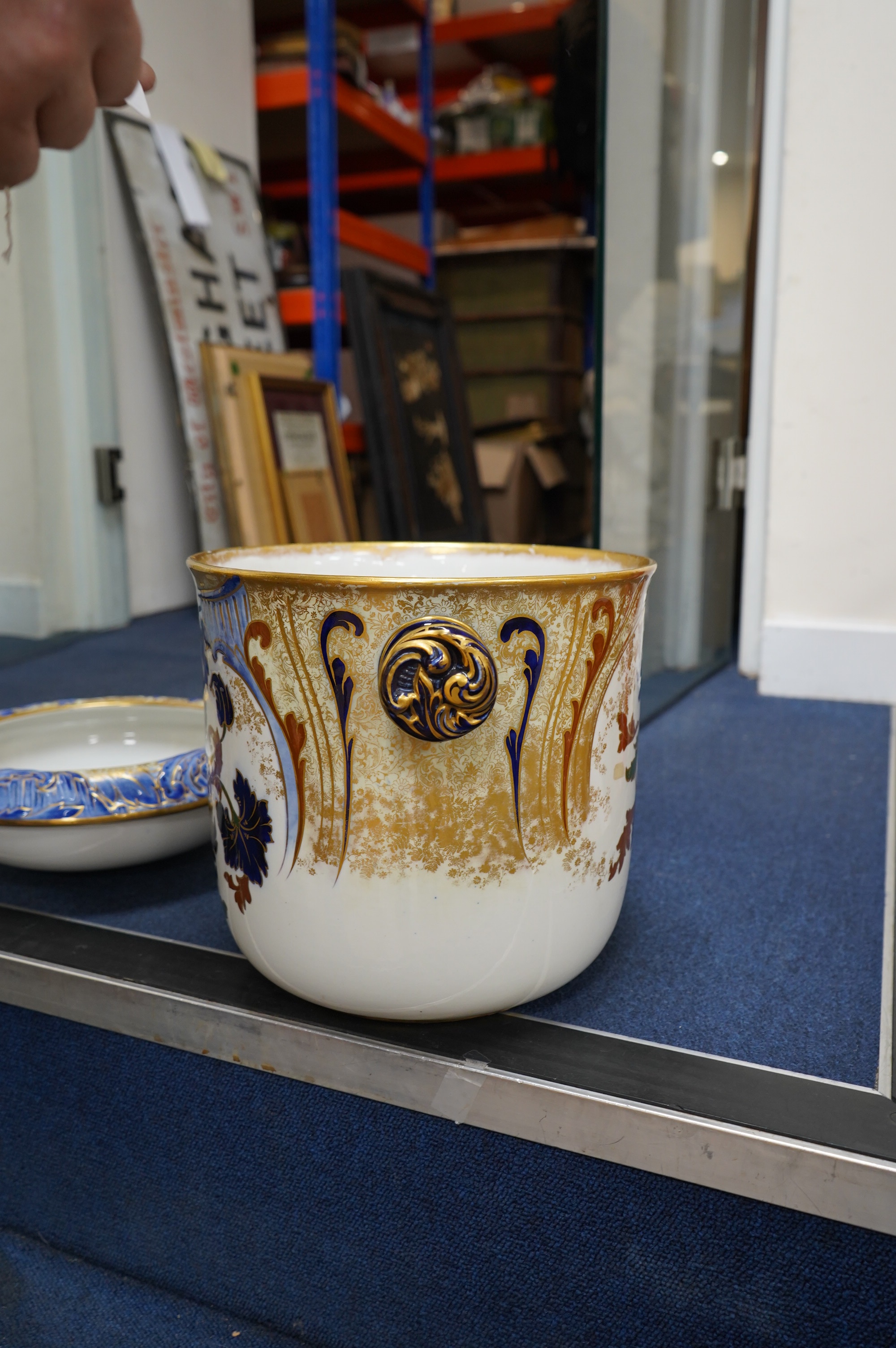 A Victorian Royal Doulton gilt and floral decorated pail, 28cm high. Condition - poor, crack to back